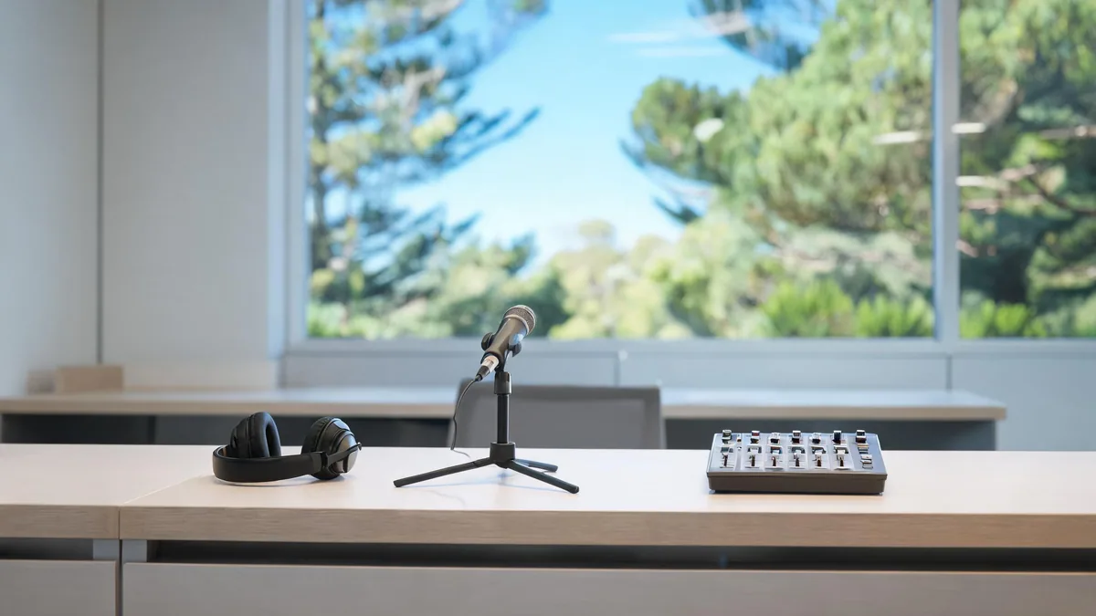 Small newsroom desk with microphone and mixer